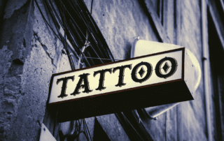 Tattoo shop sign with light
