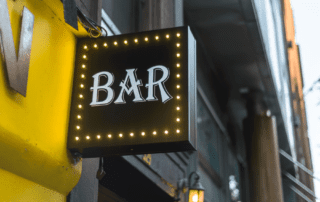 Small bar sign in wall with lights